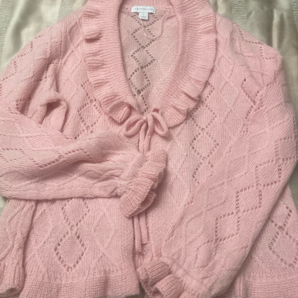 Pink, tie in front, ruffled neck and sleeves,sweater.